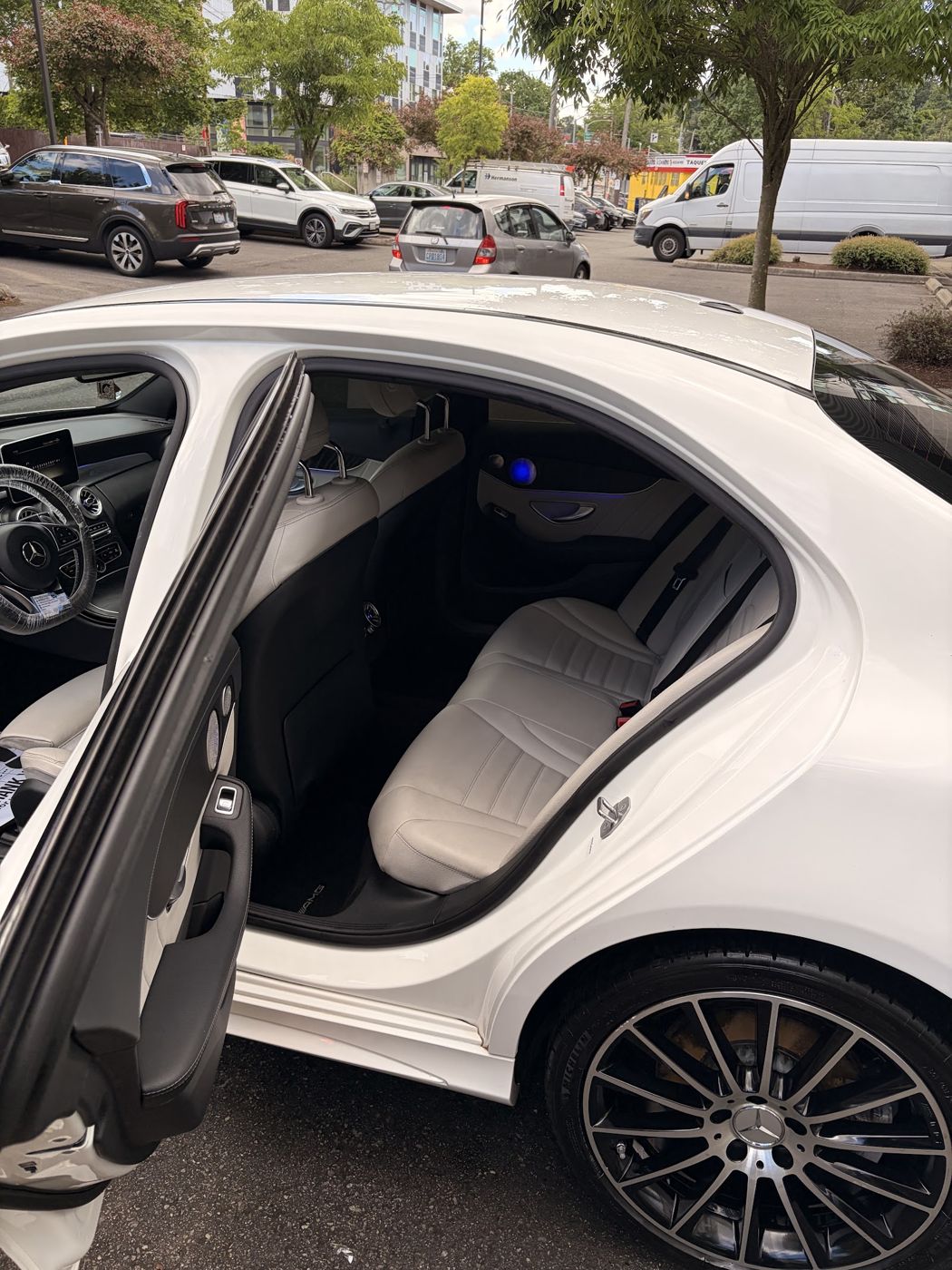 White leather rear seats of a Mercedes after an interior detail